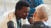 Male patient speaks with therapist